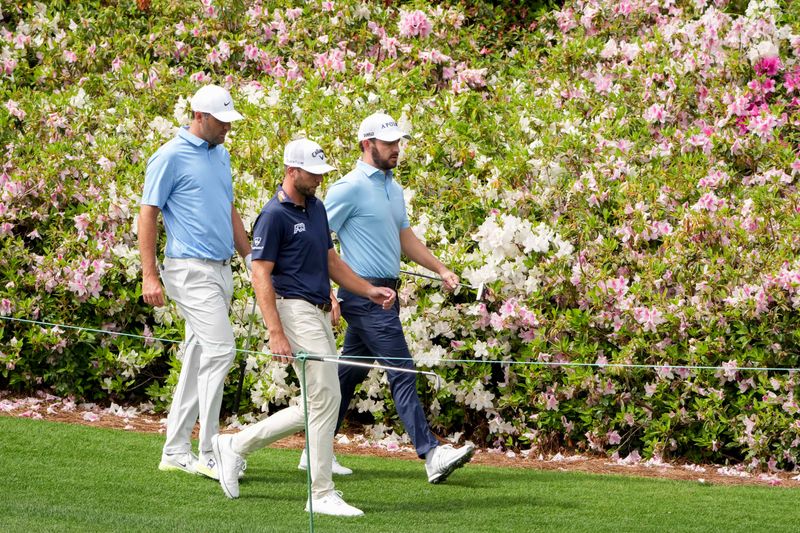Apr 7, 2026; Augusta, Georgia, USA; Scottie Scheffler, Sam Burns and Patrick Cantlay walk the no. 6 fairway during a practice round for the Masters Tournament at Augusta National Golf Club. Mandatory Credit: Michael Madrid-Imagn Images
