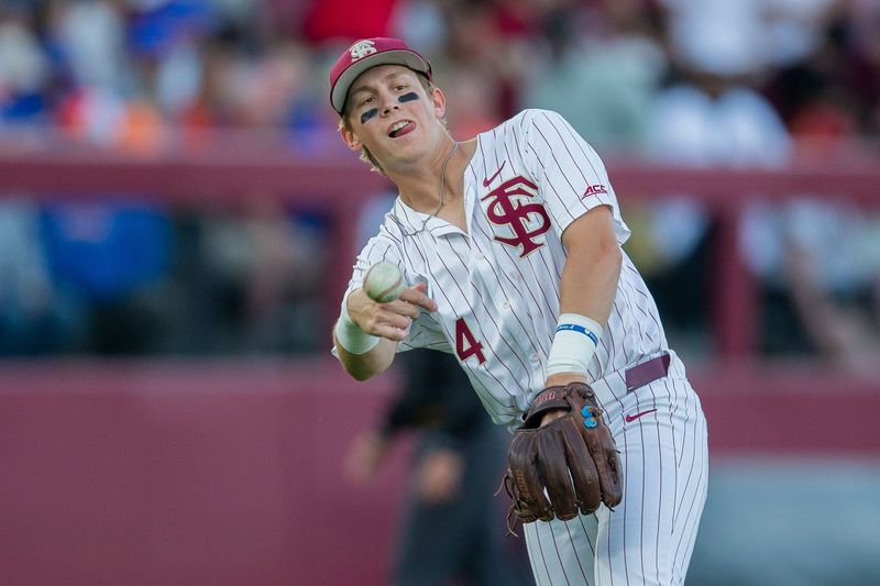 Florida State Seminoles infielder Cal Fisher (4) throws to first. The Florida State Seminoles hosted the Florida Gators at Dick Howser Stadium on Tuesday, April 7, 2026.