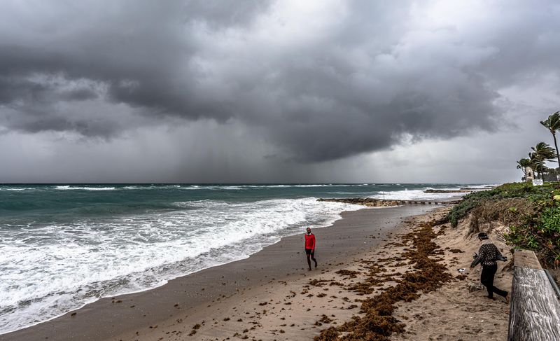 A few people braved Midtown Beach early in the morning on April 8, despite extremely rough surf and overcast skies. Dangerous ocean conditions were expected along Palm Beach's coastline through the end of the week.