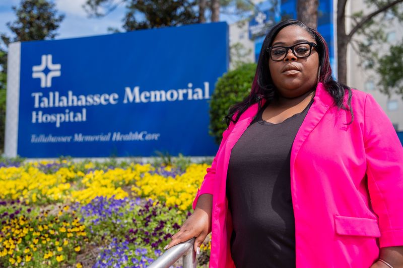 Brianna Bennett poses for a portrait outside Tallahassee Memorial HealthCare on Wednesday, April 8, 2026. Bennett was forced to have a court-ordered C-section at TMH three years ago.
