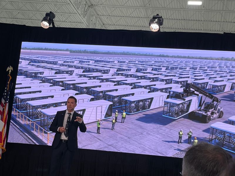 Brian Matthews, founder and CEO of Ampera, a start-up company that will create and mass produce deployable nuclear energy units, speaks at a grand opening April 8 at its new headquarters in the Gardens Innovation Center at PGA National Commerce Park.