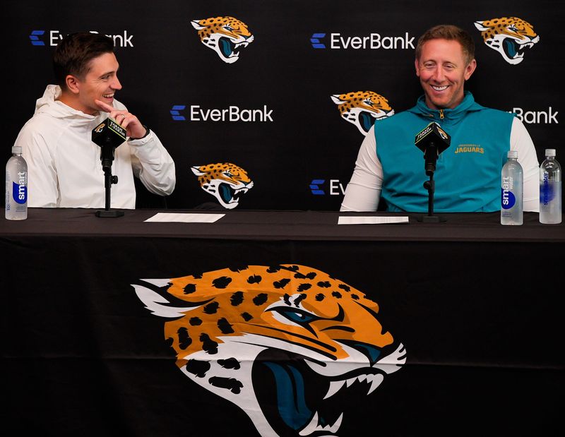 Jaguars General Manager James Gladstone, left and head coach Liam Coen joked when asked how Executive Vice President of Football Operations Tony Boselli effects their draft picks during the Jacksonville Jaguars’ annual pre-draft luncheon press conference in the media room at the Miller Electric Center Thursday April 9, 2026 in Jacksonville, Fla. [Doug Engle/Florida Times-Union]