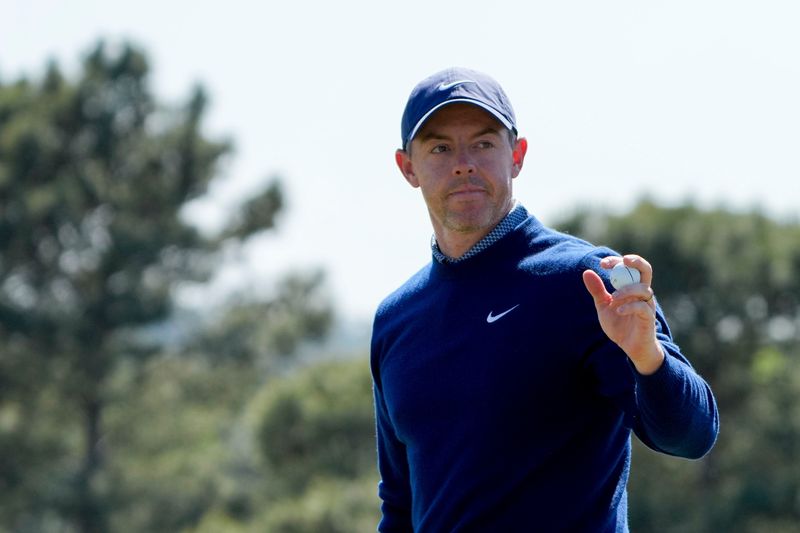 Apr 9, 2026; Augusta, Georgia, USA; Rory McIlroy acknowledges the crowd on the 18th green during the first round of the Masters Tournament at Augusta National Golf Club. Mandatory Credit: Kyle Terada-Imagn Images