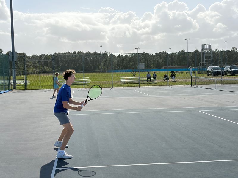 Owen Brady prepares to return a serve in a singles match against St. Augustine's Von Goode at Matanzas High School on April 9, 2026.
