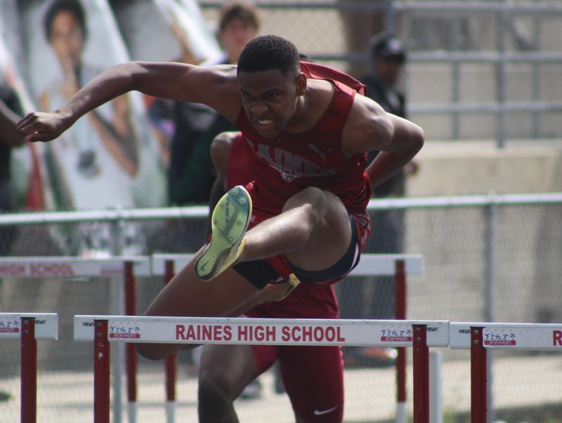 Raines' Iason Williams clears a hurdle in the boys 110-meter hurdles during the Gateway Conference high school track and field championships on April 9, 2026. [Clayton Freeman/Florida Times-Union]