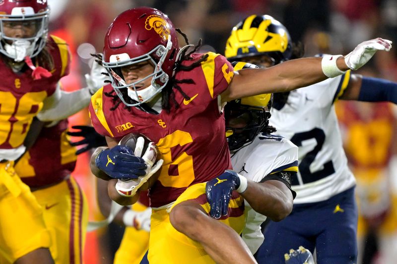Oct 11, 2025; Los Angeles, California, USA; USC Trojans wide receiver Makai Lemon (6) takes the ball on a kickoff return in the second half against the Michigan Wolverines at United Airlines Field at the Los Angeles Memorial Coliseum. Mandatory Credit: Jayne Kamin-Oncea-Imagn Images