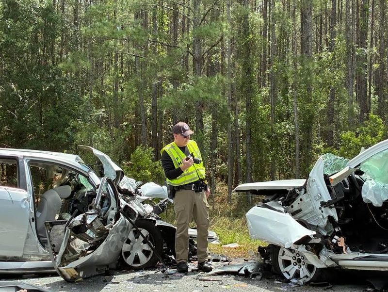 Florida Highway Patrol Traffic Homicide Investigator Cpl. Brett Detweiler takes pictures of the two vehicles involved in a fatal wreck along County Road 315 on April 10, 2026.