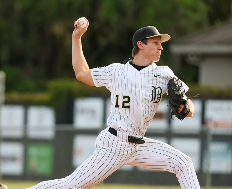 Buchholz Reed Thomas (12) pitches during an FHSAA baseball game at Buchholz in Gainesville, FL on Friday, April 10, 2026. Buchholz shut out Vanguard 6-0 [Alan Youngblood/Gainesville Sun]