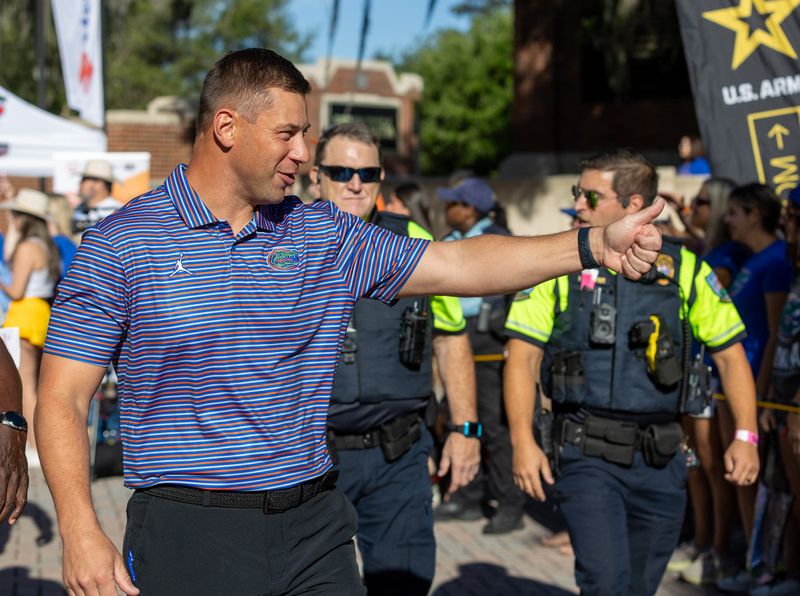 Florida Head Coach Jon Sumrall greats fans as he heads to the locker room during Gator Walk before the Orange and Blue game at Steve Spurrier Field at Ben Hill Griffin Stadium in Gainesville, FL on Saturday, April 11, 2026. [Alan Youngblood/Gainesville Sun]
