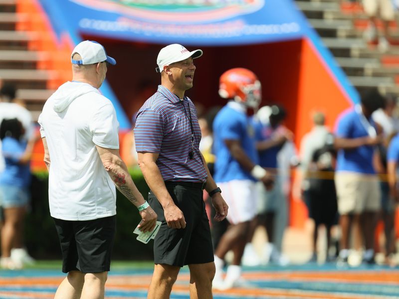 Florida head coach Jon Sumrall enjoys a laugh before the Orange and Blue game at Steve Spurrier Field at Ben Hill Griffin Stadium in Gainesville, FL on Saturday, April 11, 2026. [Alan Youngblood/Gainesville Sun]
