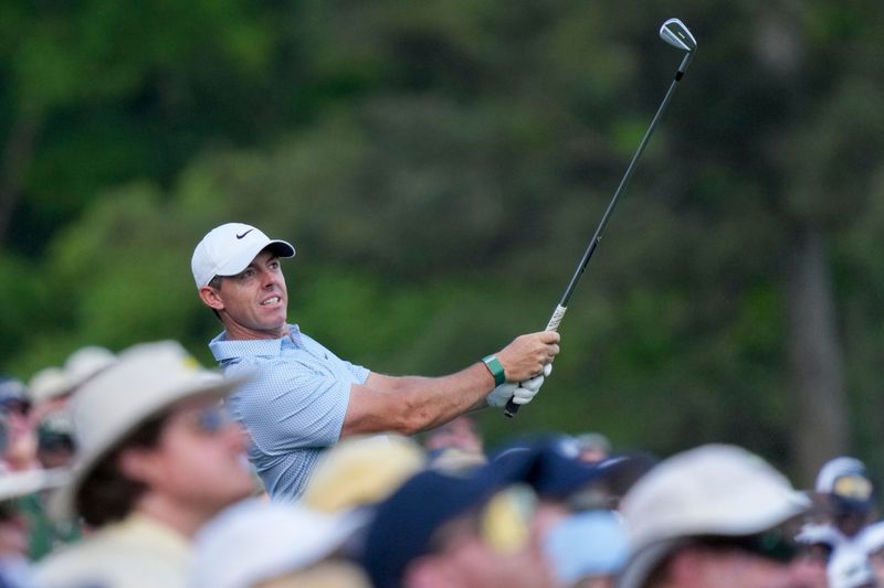 Rory McIlroy tees off on the 12th hole during the final round of the 2026 Masters Tournament at Augusta National Golf Club. Mandatory Credit: Grace Smith-Imagn Images