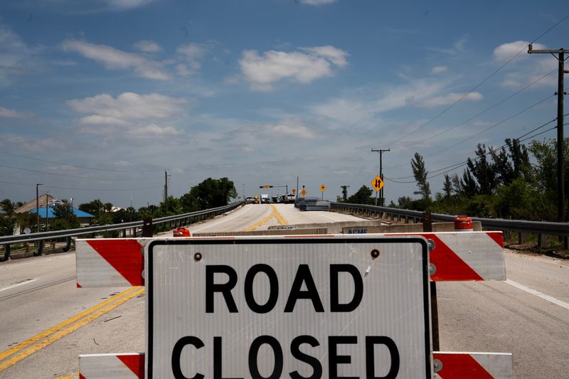 Crew work on the State Road 31 bridge that connects Fort Myers to North Fort Myers on Monday, April 13, 2026. The bridge is closed for critical safety upgrades according to a press release from the Florida Department of Transportation. The bridge is expected to be closed up to 10 days. Motorists are being detoured around the bridge.