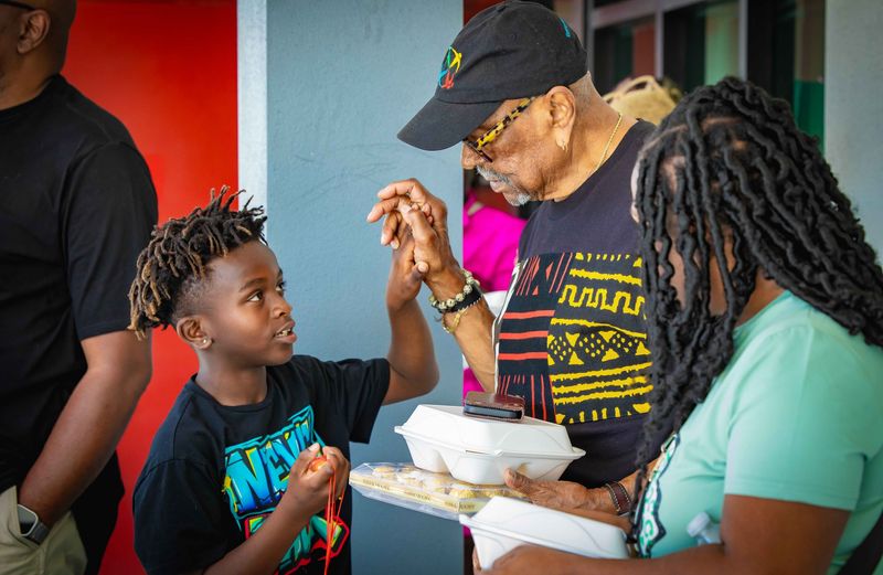 A Freedom School student and mentor share a connection during a Manasota ASALH Freedom School session.