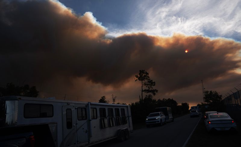Smoke from a brush fire billows over Collier County on Monday, April 13, 2026.