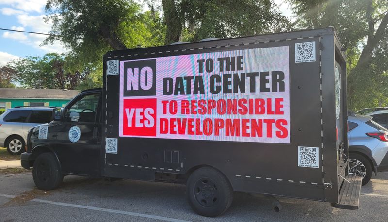 A sign protesting the proposed hyperscale data center in Fort Meade sits outside the City Commission meeting on April 14, 2026, where commissioners were to vote on the development agreement.