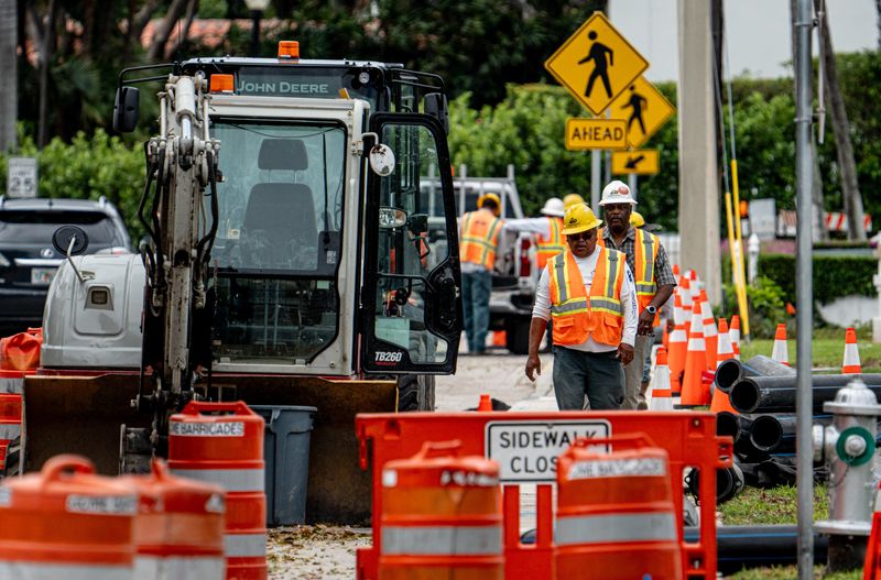 Burkhardt Construction crews work on a project to replace a 16-inch water main that runs below Cocoanut Row between Chapel Hill Road and Palm Beach Towers in Palm Beach on April 15.