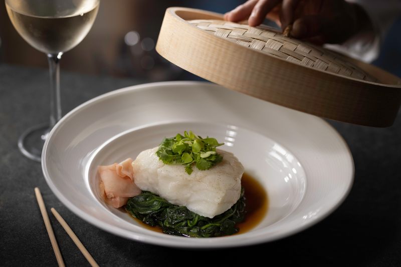 Eddie V's Chilean Sea Bass is served in a steamer Hong Kong-style. A new outpost opens at Legacy in Palm Beach Gardens.