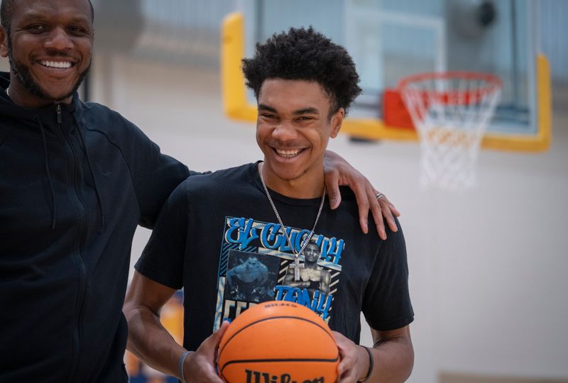 A portrait of JD Jones (right) with his dad, James Jones at Phoenix Country Day School in Paradise Valley, Arizona, on Dec. 23, 2025.