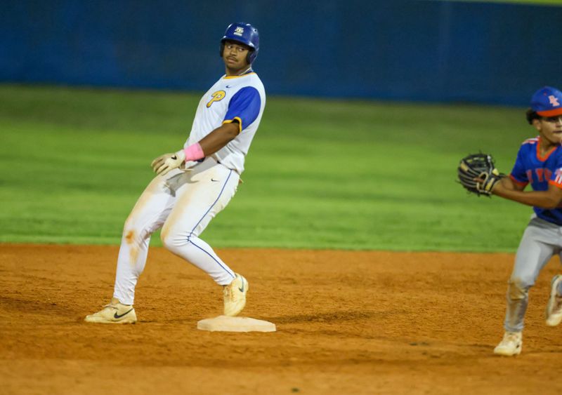 Newberry Tavis Honeycutt (22) makes second during an FHSAA baseball game at Newberry High School in Newberry , FL on Wednesday, April 15, 2026. Newberry won 11-1 in five Innings. [Alan Youngblood/Gainesville Sun]