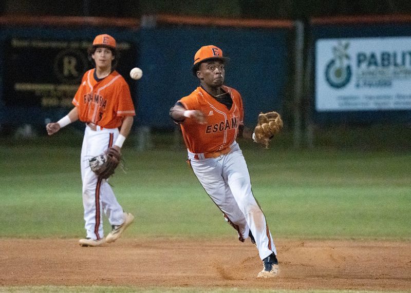 Gators third baseman J.R. Riley (5) throws to first for an out against the Wildcats during the Booker T. Washington vs Escambia 1-4A District semifinal baseball game at Escambia High School in Pensacola on April 15, 2026.