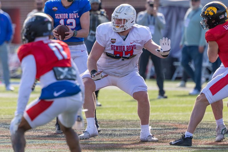 Jan 29, 2026; Mobile, AL, USA; National offensive lineman Keylan Rutledge (77) of Georgia Tech blocks during National Senior Bowl practice at Hancock Whitney Stadium. Mandatory Credit: Vasha Hunt-Imagn Images
