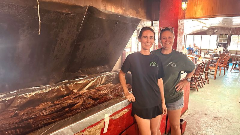 From left, sisters Erica Strickland and Jessica Knowles are third generation co-owners of Peebles BBQ in Auburndale. Today, three generations still work behind the scenes to provide lip-smacking barbecue and friendly service.