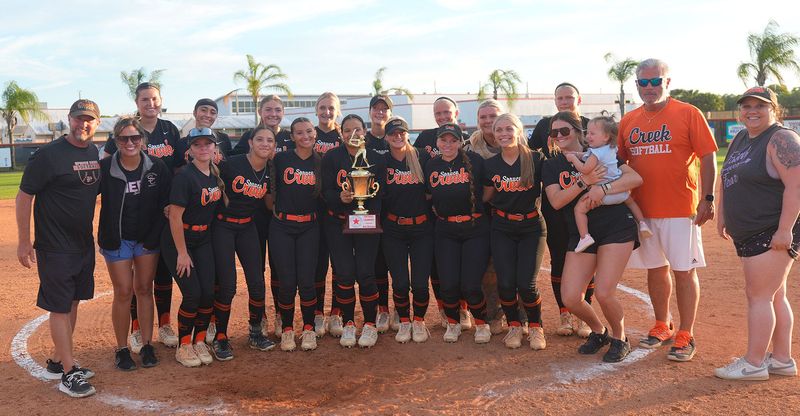 Spruce Creek’s girls softball team poses with the Five Star Conference trophy after beating University in the final on April 16, 2026, at Spruce Creek High School.