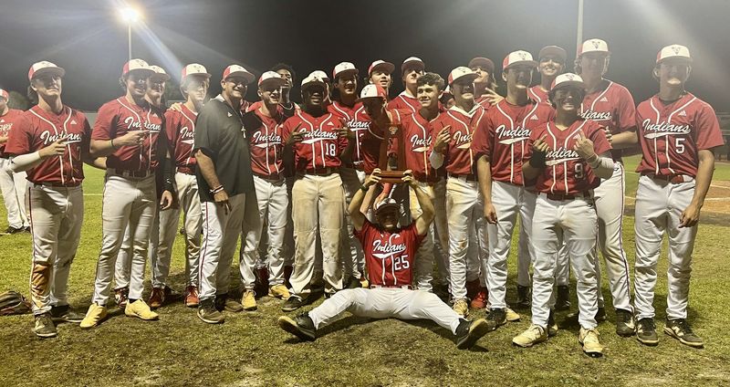 The Vero Beach High baseball team poses with the championship trophy after winning the Class 7A-District 10 title with a 9-0 whitewash of Treasure Coast on Thursday, April 16 in Vero Beach. It was Vero Beach's third consecutive district crown.