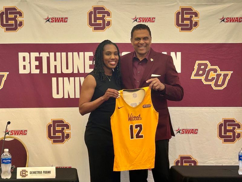 New Bethune-Cookman women's basketball coach Demetria Frank stands with athletic director Reggie Theus for a photo during her introductory press conference on April 16, 2026.