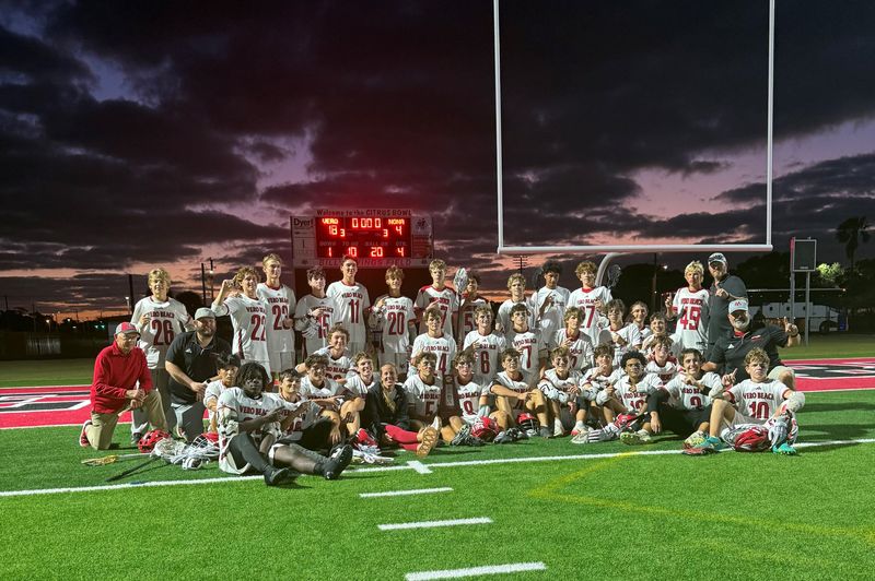 The Vero Beach High School boys lacrosse team celebrates after defeating Lake Nona 18-4 during the District 8-2A Final on Wednesday, April 15, 2026 from the Citrus Bowl.