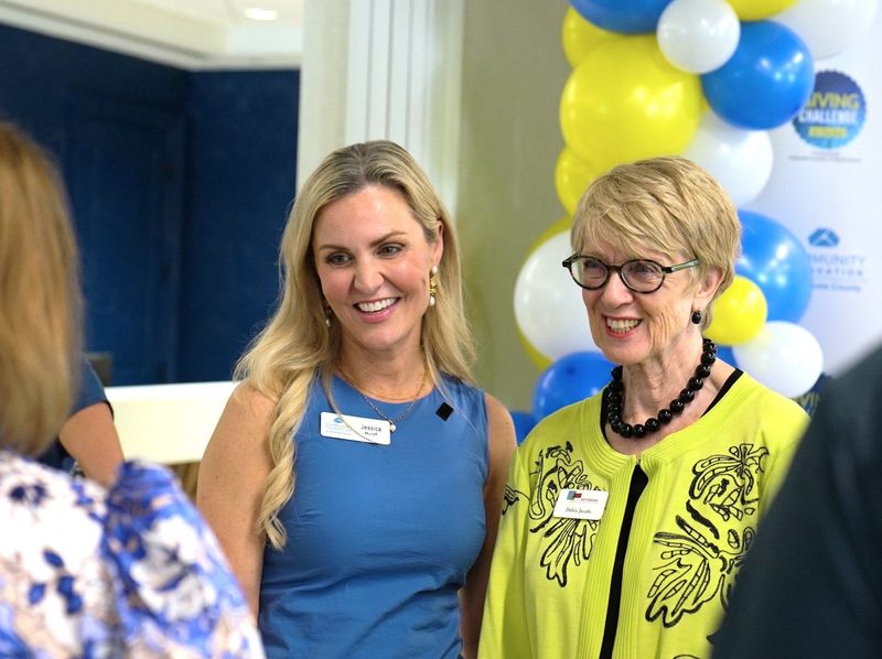 Community Foundation of Sarasota County President and CEO Jessica Muroff, left, and Debra Jacobs, the president and CEO of The Patterson Foundation, right, celebrate the results of the 2026 Giving Challenge during a Thursday, April 16, 2026, event at the Community Foundation in Sarasota. This year's Giving Challenge, which was a 24-hour fundraiser held April 15 to April 16, raised $16.7 million to support 751 area nonprofits