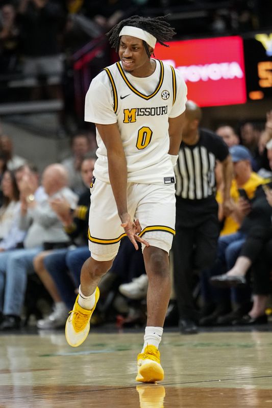 Feb 18, 2026; Columbia, Missouri, USA; Missouri Tigers guard Anthony Robinson II (0) celebrates after scoring against the Vanderbilt Commodores during the second half of the game at Mizzou Arena. Mandatory Credit: Denny Medley-Imagn Images