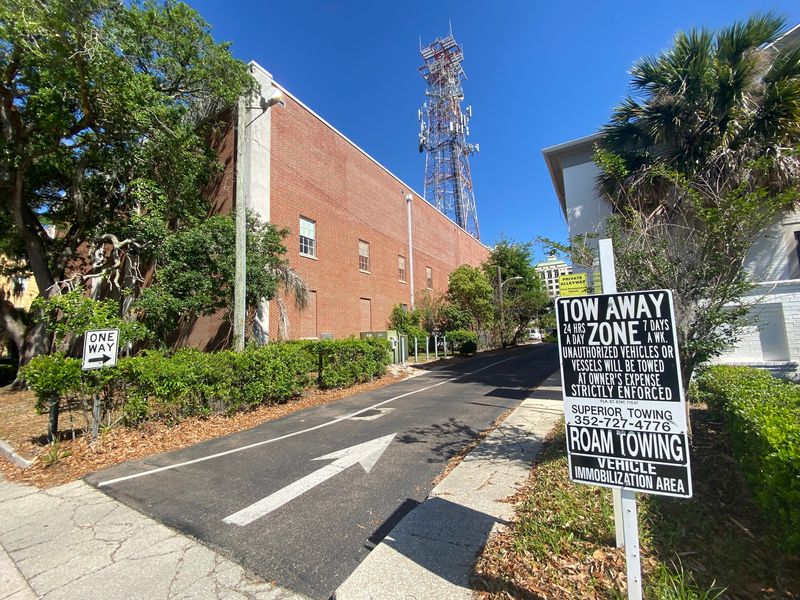 A tow-away zone sign stands near First Presbyterian Church on Southwest Second Avenue in Gainesville.