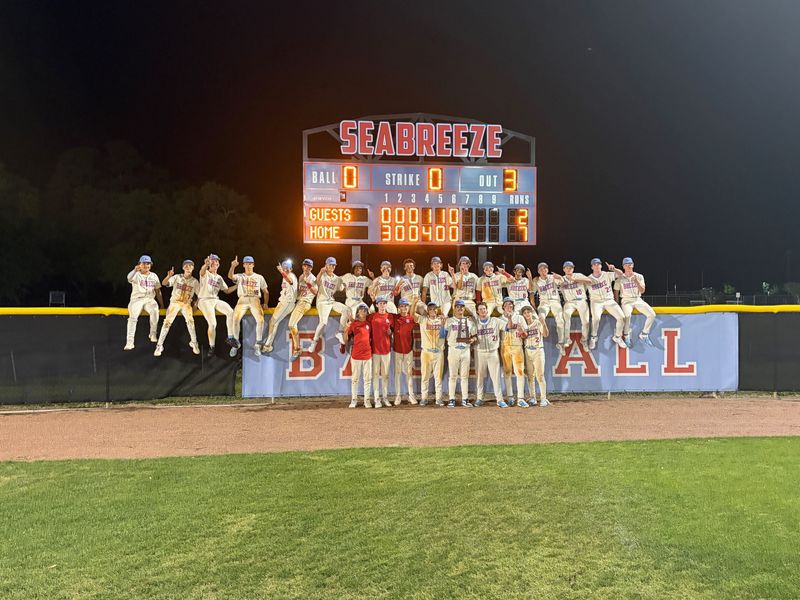 Seabreeze's baseball team poses in front of the scoreboard after beating Belleview 7-2 for its second consecutive District 5-5A title on April 17, 2026, at Ormond Beach Sports Complex.