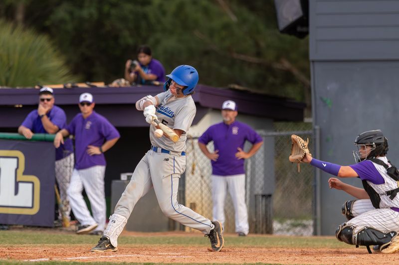 Sebastian River’s Preston Mer (5) connects with the ball for a base hit during a baseball District 13-5A final against Okeechobee, April 17, 2026, at Okeechobee High School. Okeechobee won 6-0.