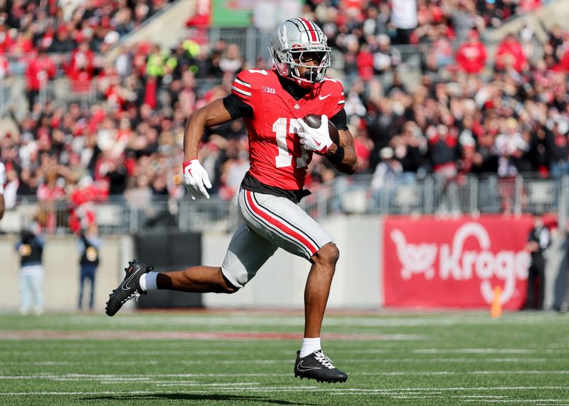 Ohio State Buckeyes wide receiver Carnell Tate (17) catches a long pass during the third quarter against the Penn State Nittany Lions at Ohio Stadium in Columbus on Nov. 1, 2025.