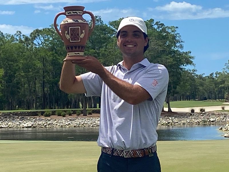 Connor Doyal, a 26-year-old mid-amateur golfer from Charleston, S.C., celebrates with the trophy after winning the 30th annual Terra Cotta Invitational on Saturday, April 18, 2026.