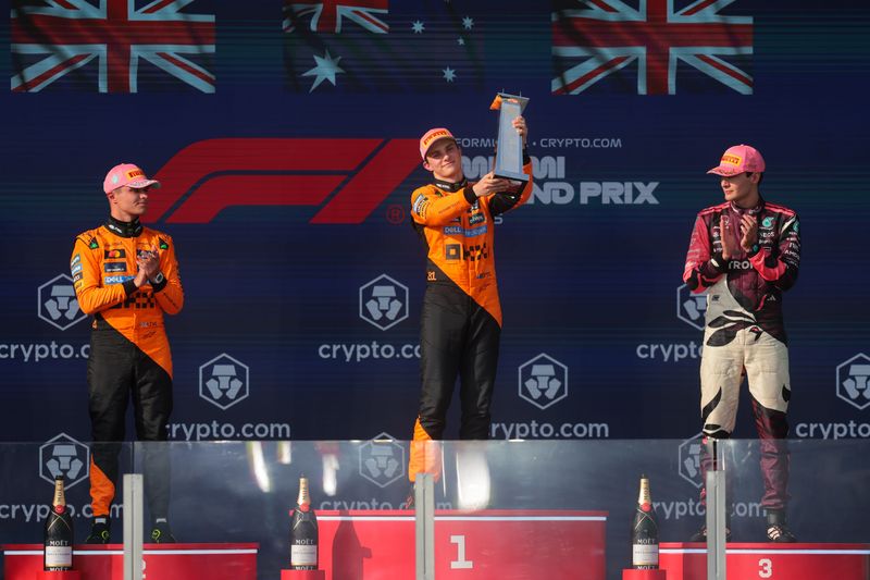 May 4, 2025; Miami Gardens, FL, USA; McLaren driver Oscar Piastri (81) celebrates at the podium after winning the F1 Miami Grand Prix at Miami International Autodrome. Mandatory Credit: Sam Navarro-Imagn Images