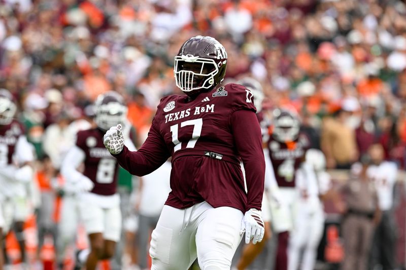 Dec 20, 2025; College Station, TX, USA; Texas A&M Aggies defensive tackle Albert Regis (17) celebrates during the game between the Aggies and the Hurricanes at Kyle Field. Mandatory Credit: Jerome Miron-Imagn Images
