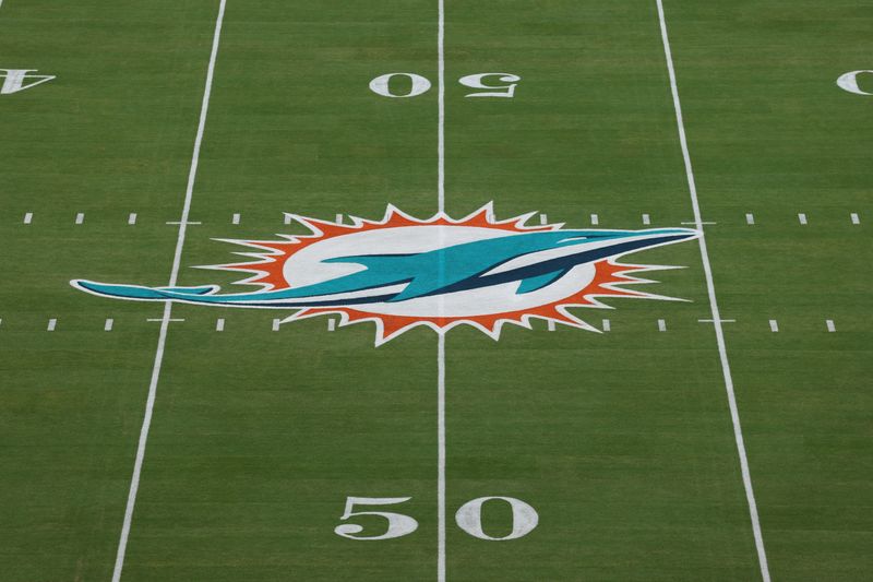 Oct 30, 2025; Miami Gardens, Florida, USA; The Miami Dolphins logo is seen at midfield prior to a game against the Baltimore Ravens 
at Hard Rock Stadium. Mandatory Credit: Nathan Ray Seebeck-Imagn Images