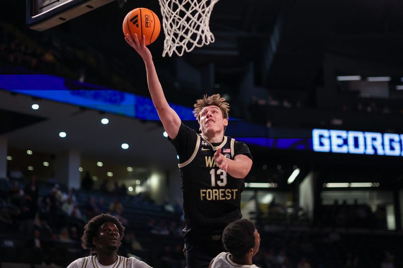 Feb 11, 2026; Atlanta, Georgia, USA; Wake Forest Demon Deacons forward Cooper Schwieger (13) shoots against the Georgia Tech Yellow Jackets in the first quarter at McCamish Pavilion. Mandatory Credit: Brett Davis-Imagn Images