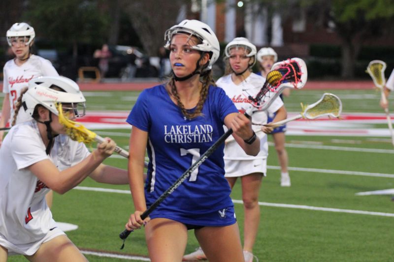 Lakeland Christian girls lacrosse played in the Class 1A regional quarterfinals against Lake Highland Preparatory School on April 22, 2026 in Orlando. Lakeland Christian sophomore midfielder Kendall Reber (7) scored the games only goal. No. 13 is seventh-grader Bella Woods.