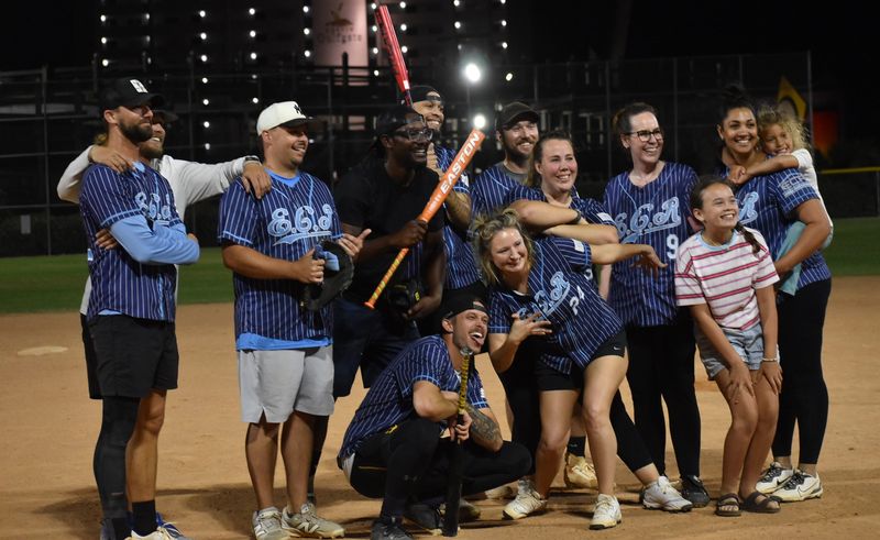 Emerald Coast Roofscapes were celebrating on the field with a few photos after posting two wins on opening night of the coed softball tournament on April 22 at Morgan Sports Center. ECR beat The GAB Spot 22-19 and then Destin Commons 19-13.
