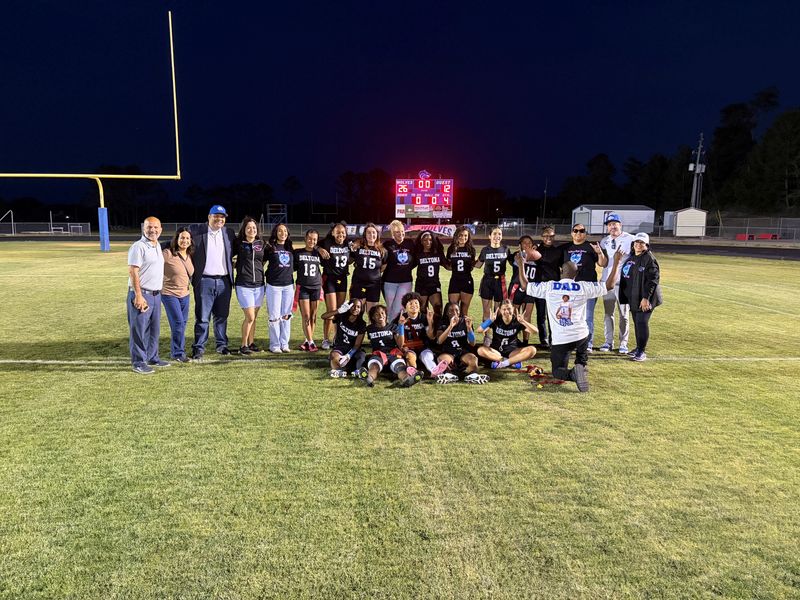 Deltona flag football poses with the District 7-2A trophy after beating New Smyrna Beach in the final on April 23, 2026, at Deltona High School.