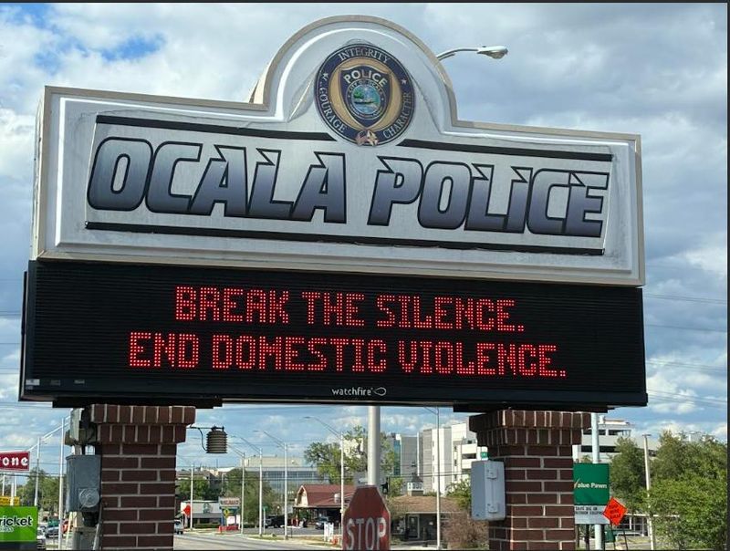 A domestic violence sign posted at the Ocala Police Department headquarters on April 23, 2026.