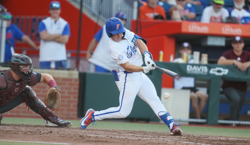 Florida infielder Cade Kurland (4) hits during an NCAA baseball game at Condron Family Ballpark at Alfred A. McKethan Field in Gainesville, FL on Friday, April 24, 2026. [Alan Youngblood/Gainesville Sun]