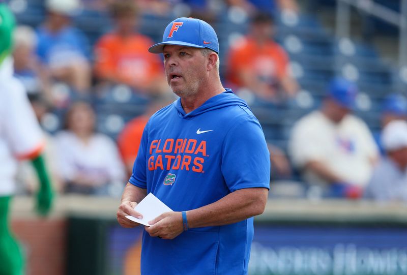 Florida head coach Kevin O'Sullivan heads to the dugout before an NCAA baseball game at Condron Family Ballpark at Alfred A. McKethan Field in Gainesville, FL on Friday, April 24, 2026. [Alan Youngblood/Gainesville Sun]
