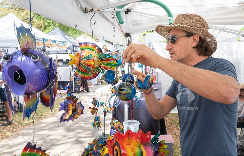 Federico Aloisi, of Sarasota, shows off the metal sea creates that he is selling during the Crawfish Festival in downtown Pensacola on April 24, 2026.