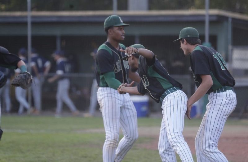 Chase Fuller celebrates with teammates after earning save to lead Lincoln to 6-4 victory over Gulf Breeze on Friday April, 24, 2026.
