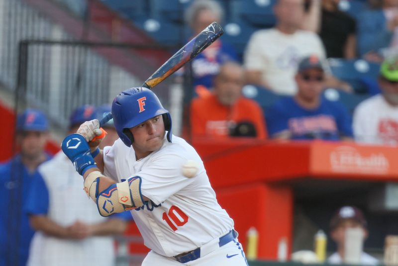 Florida infielder Ethan Surowiec (10) lets the ball go by during an NCAA baseball game at Condron Family Ballpark at Alfred A. McKethan Field in Gainesville, FL on Friday, April 24, 2026. [Alan Youngblood/Gainesville Sun]